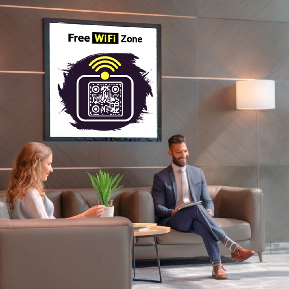 Reception desk displaying a Wi-Fi QR code for guest convenience