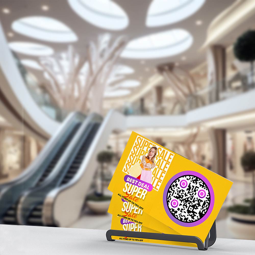A brochure on a table, prominently displaying a QR code for providing directions to a shop