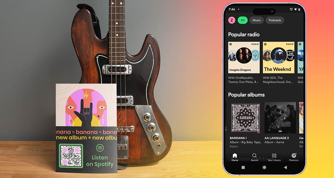 Spotify esitusloend nutitelefonis ja QR-koodiga raamatuke kitarri kõrval