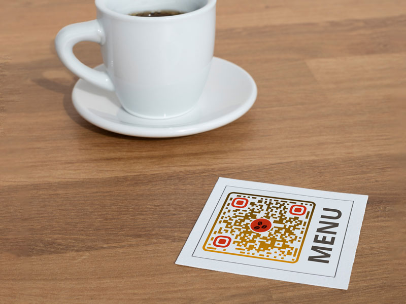A few menu logo QR codes on food court tables
